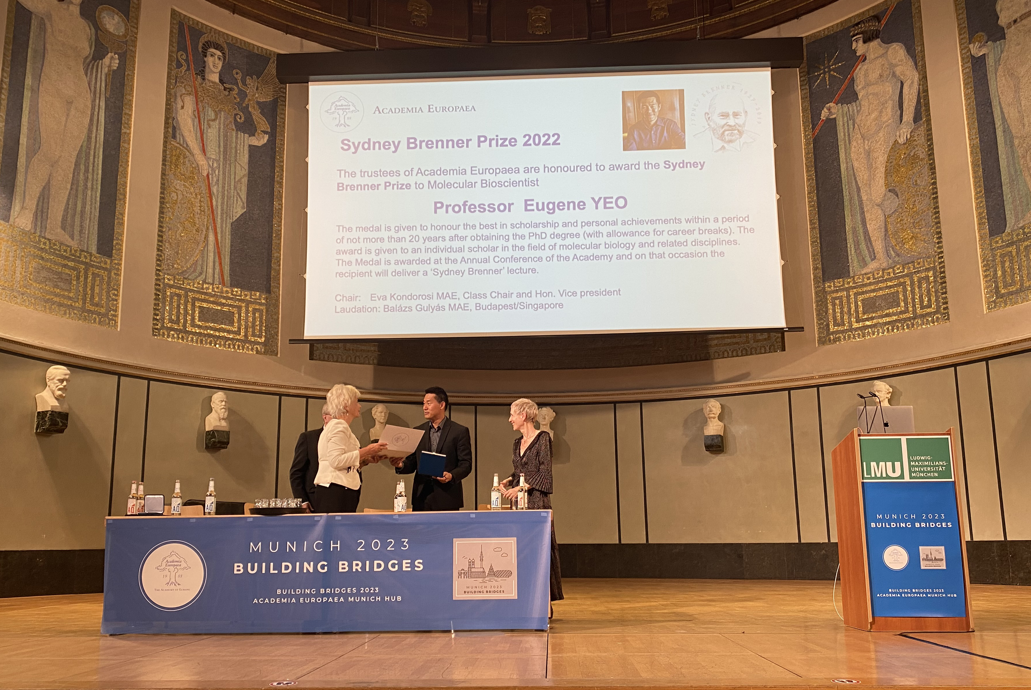 Professor Kondorosi presents the award certificate